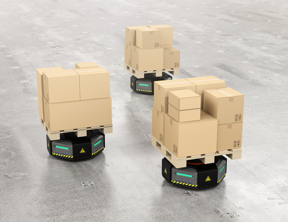 Autonomous mobile robots - AMRs - carrying boxes in a warehouse