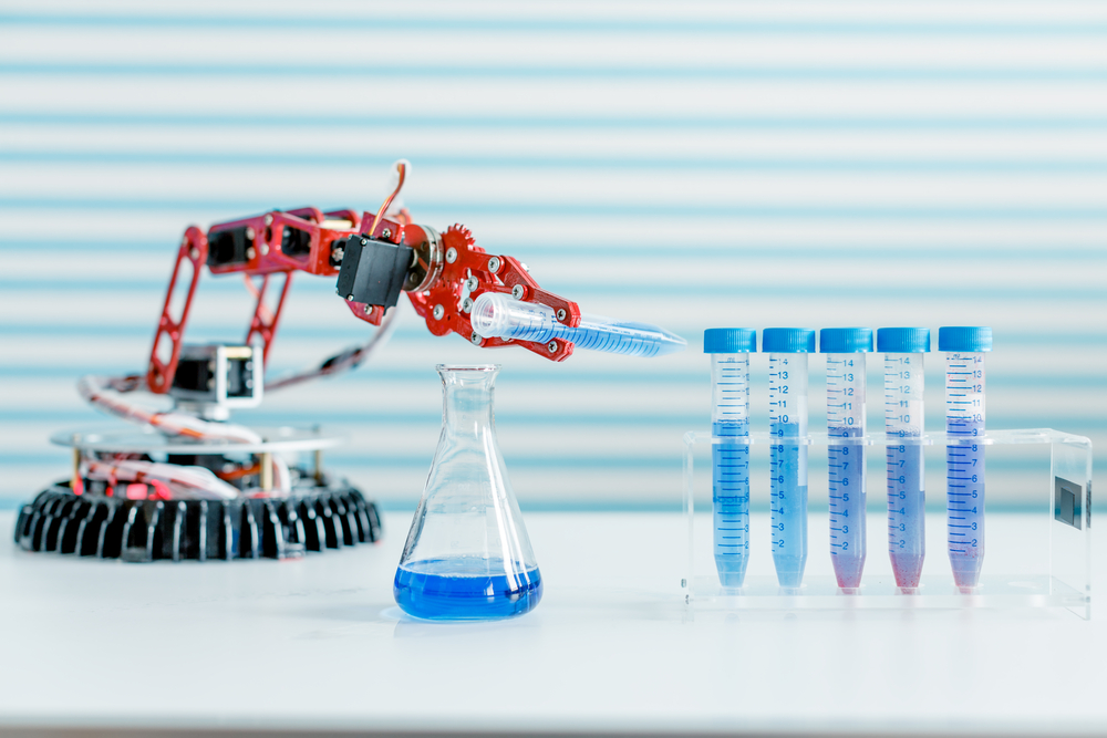 Pipetting robot - robotic arm gripping a test tube with a rack of test tubes nearby