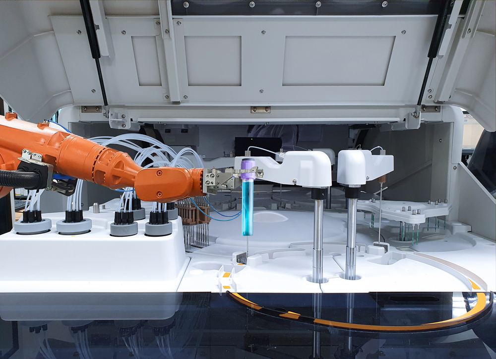 Robotic arm handling a test tube in a laboratory environment