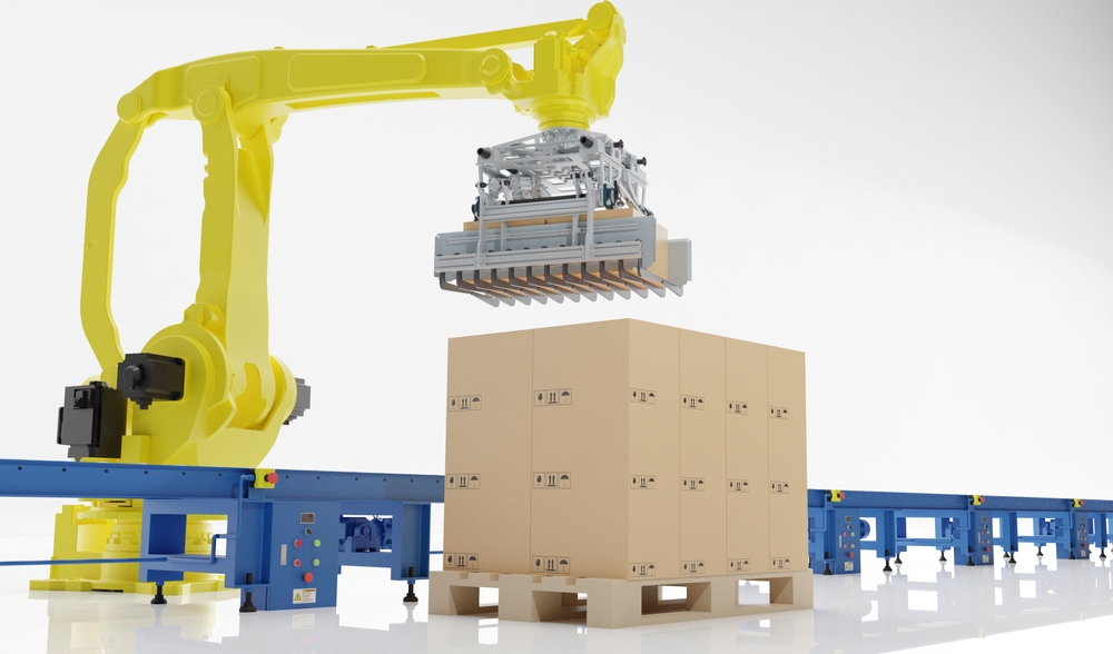 A palletizing robot arm gets ready to pick up a pallet with boxes on it next to a conveyor belt.
