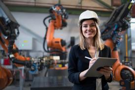 Female chief engineer in modern industrial factory